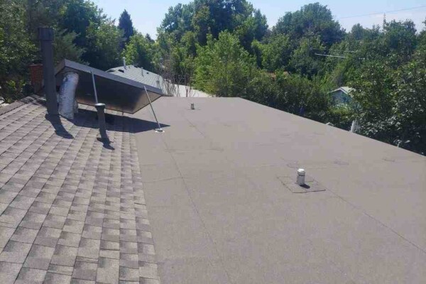 photo of finished roof with two different finishes Advanced Exteriors Denver
