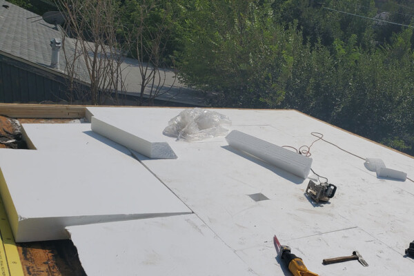 photo during replacement of residential roof Advanced Exteriors Denver