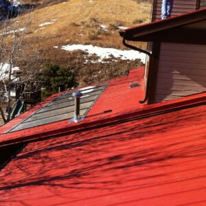 metal roof maroon Advanced Exteriors Denver